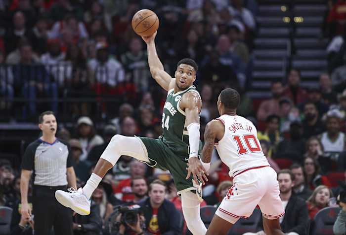 Milwaukee Bucks forward Giannis Antetokounmpo (34) catches a pass as Houston Rockets forward Jabari Smith Jr. (10) defends during the fourth quarter at Toyota Center.